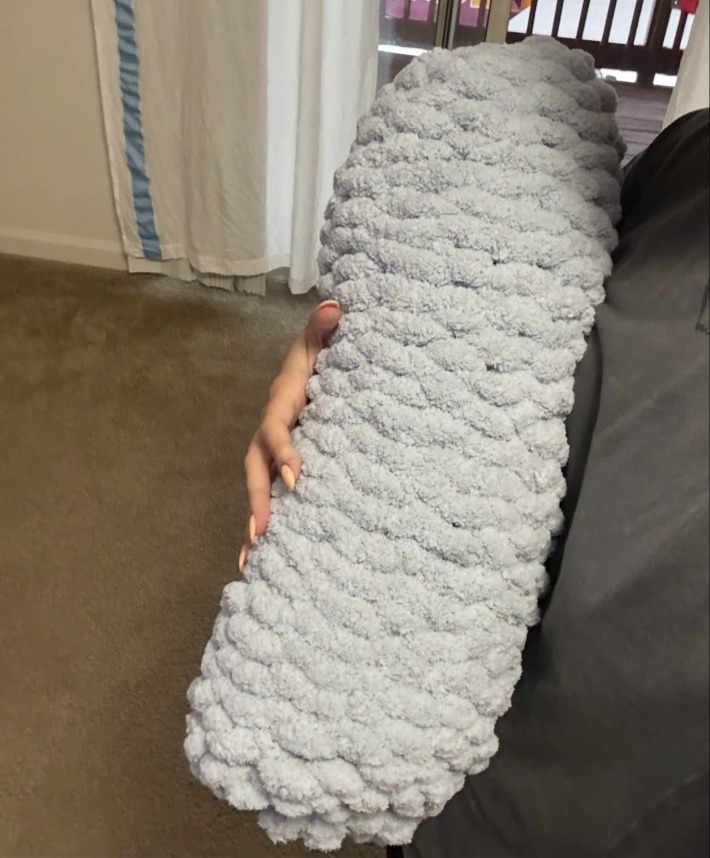 Soft blue chunky hand-knit bolster pillow